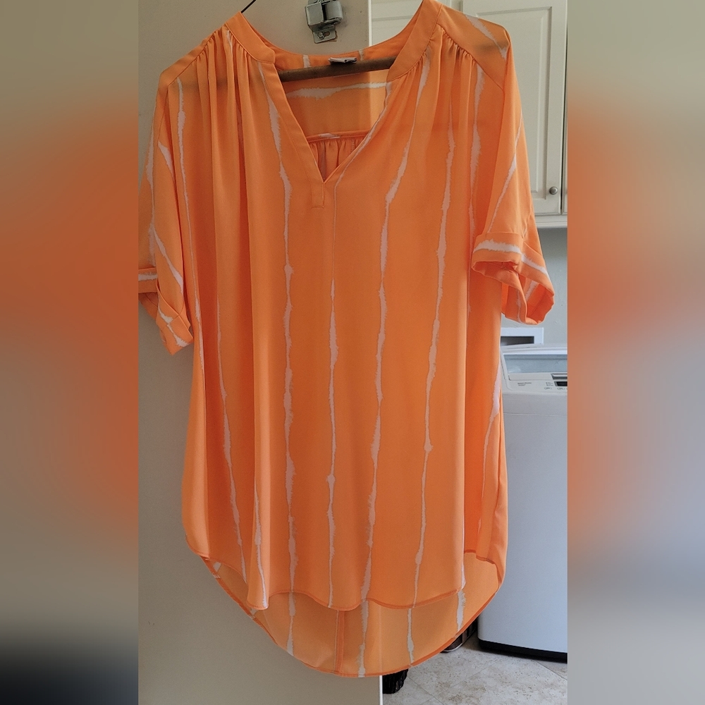 Breezy versatile bright orange blouse. Perfect addition to your closet
